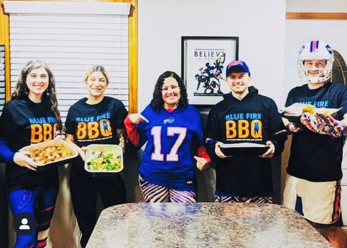 a group of people holding food